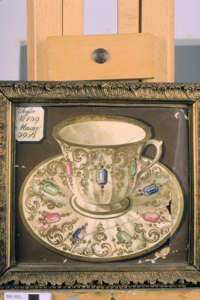 Glass picture of a cup and saucer (framed)