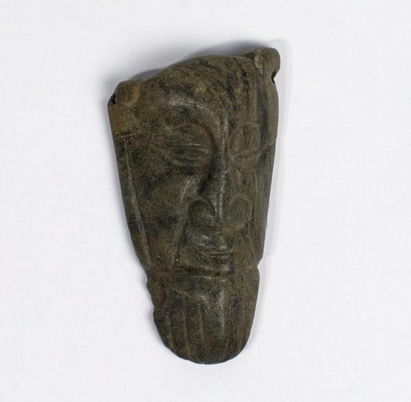 Stone carving of the head of a man